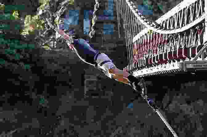 A Person Bungee Jumping Off A Bridge Over A River. The Adrenaline Junkie S Bucket List: 100 Extreme Outdoor Adventures To Do Before You Die