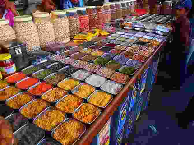 A Street Vendor Selling Spices In Mumbai, India. The Age Of Kali: Travels And Encounters In India (Text Only)