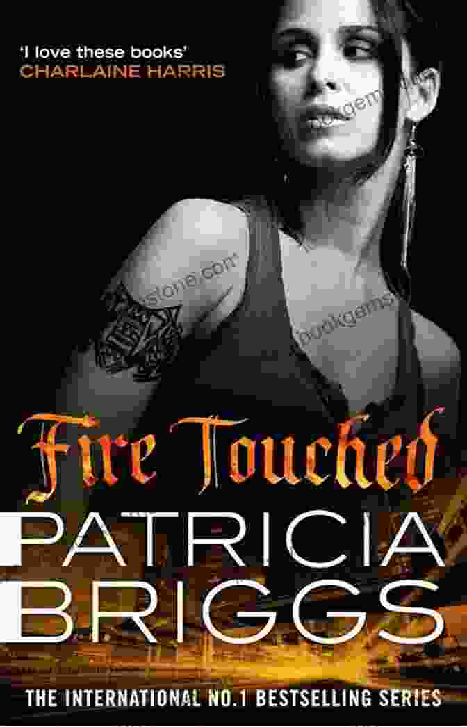 Fire Touched Novel Cover, Featuring A Woman With Long, Flowing Hair, Glowing Red Eyes, And A Wolf At Her Side Fire Touched (A Mercy Thompson Novel 9)